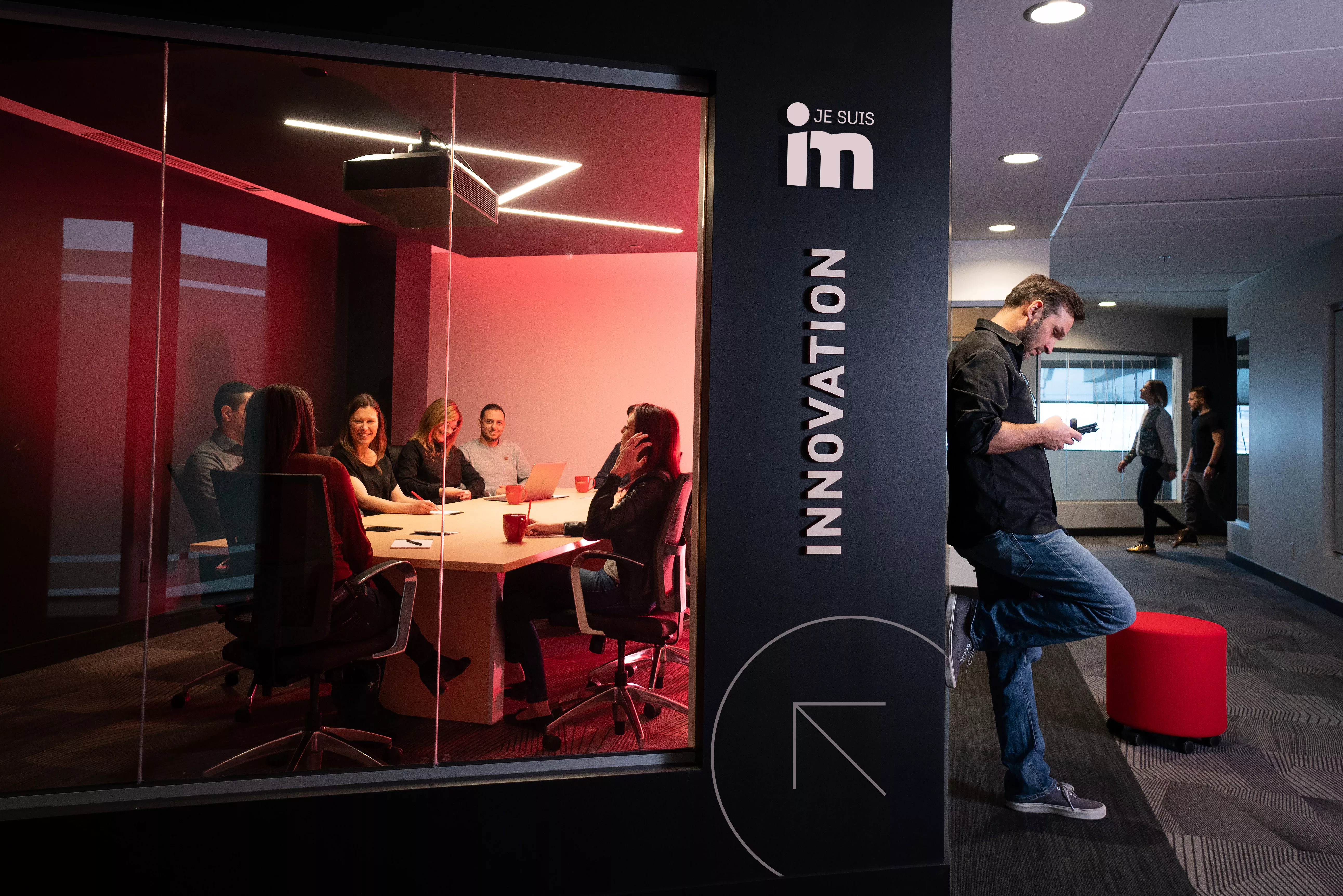 InnovMetric employees working in a meeting room